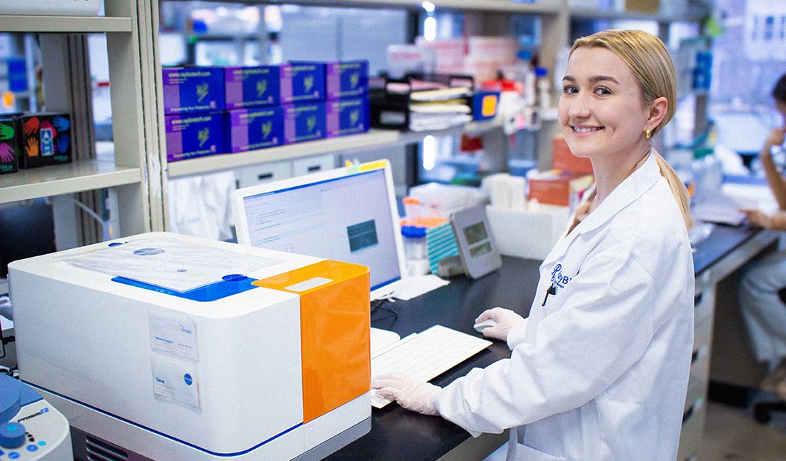 Laboratory scientist using an automatic western blot machine.